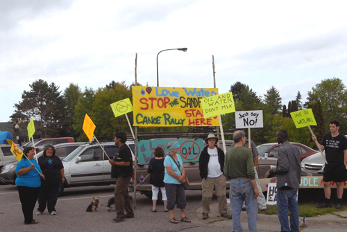 honor the earth paddles in protest against sandpiper pipeline.jpg